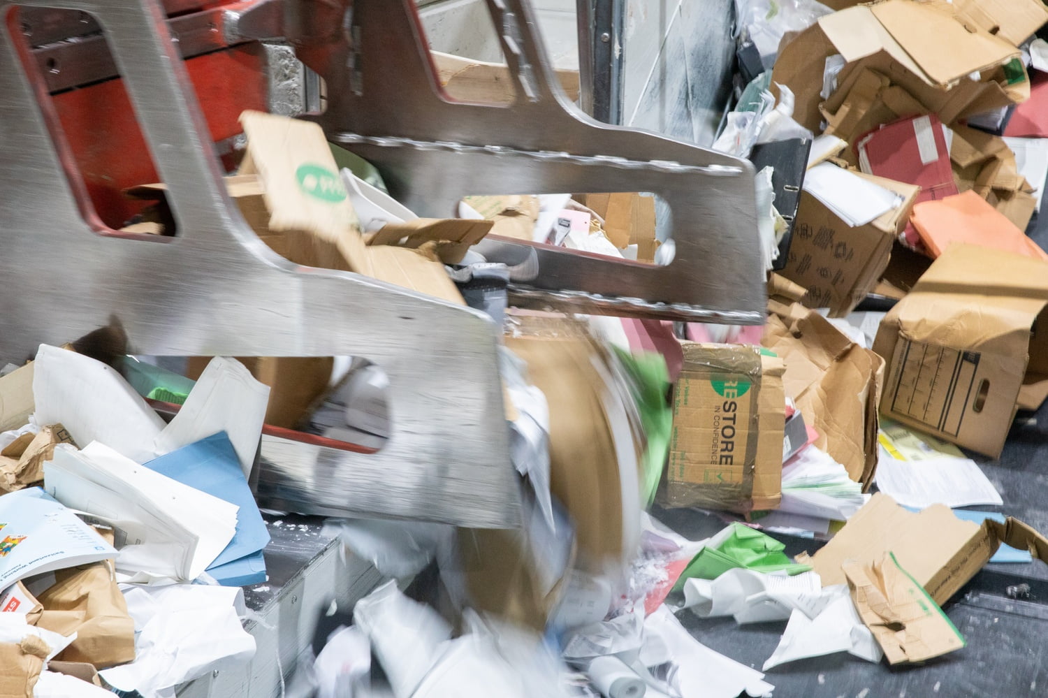 pile of cardboard collected via one-off shredding services