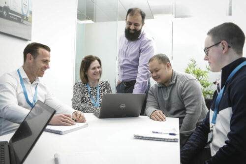 people smiling on a table