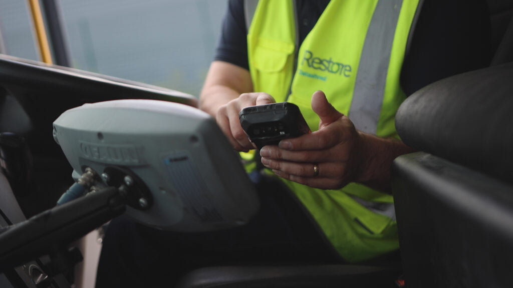 on-site paper shredding - man working on mobile