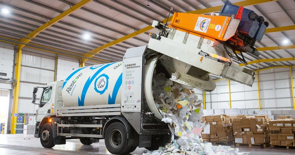 man at a paper pile