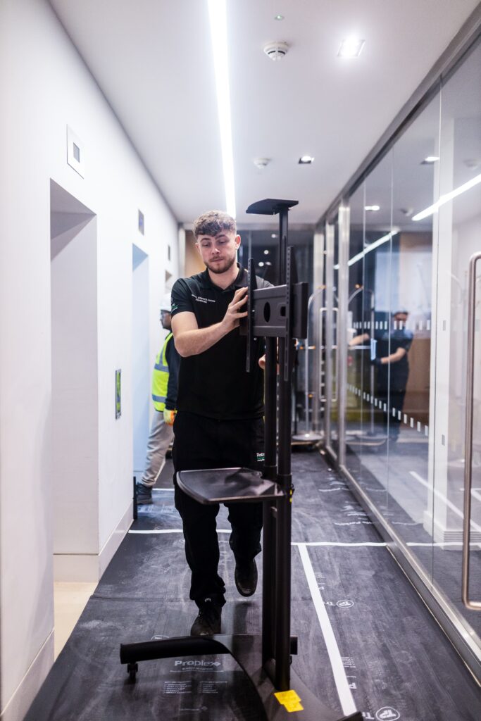 man moving office fixtures as part of relocation