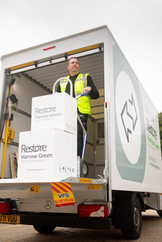 man loading boxes on back of van as part of data centre relocation