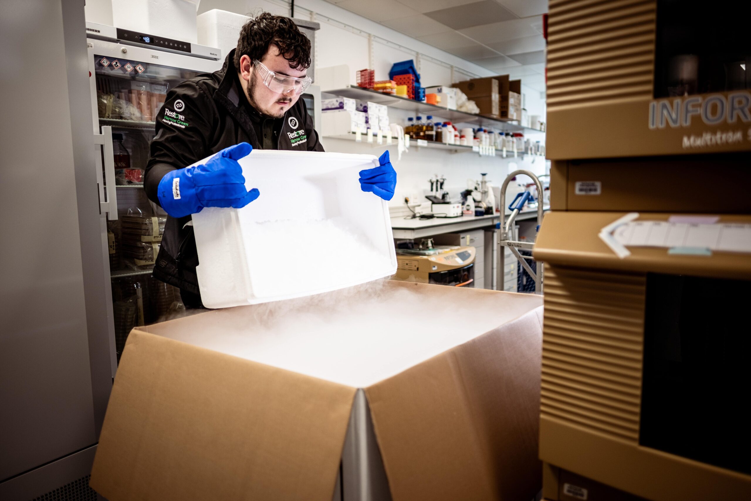 man packing with dry ice as part of laboratory relocations
