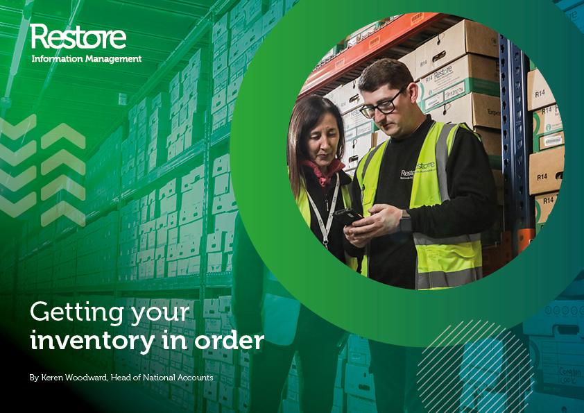 Image of two people in a warehouse checking inventory