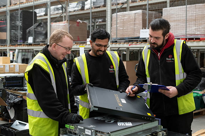 Technology operatives discussing an inventory list - IT Lifecycle Services